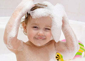 Moneysworth & Best foam sculptures on bathtub edge demonstrating creative bath play