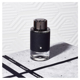 Montblanc Explorer cap close-up showing branded detail and secure closure benefit