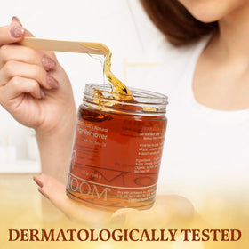 MOOM on bathroom counter in use showing an easy at-home waxing routine