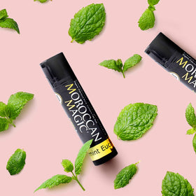 Moroccan Magic lip balm in hands outdoors for on-the-go hydration