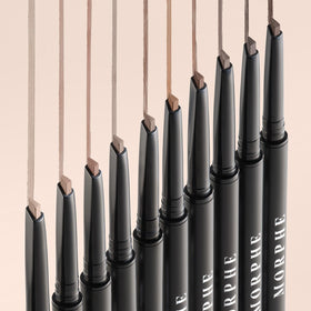 MORPHE pencil held in hand showing compact size and travel-friendly design