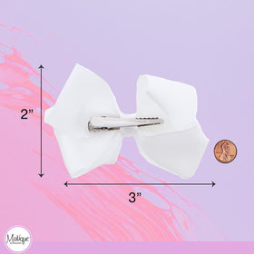 Motique Accessories scale example on a child's head showing size and fit