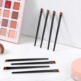 Mozeat Lens single brush beside ruler showing compact 10 cm size