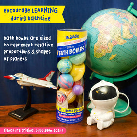 Hand holding a Mr. Bubble planet to show size and scale, useful for planning bath play benefit