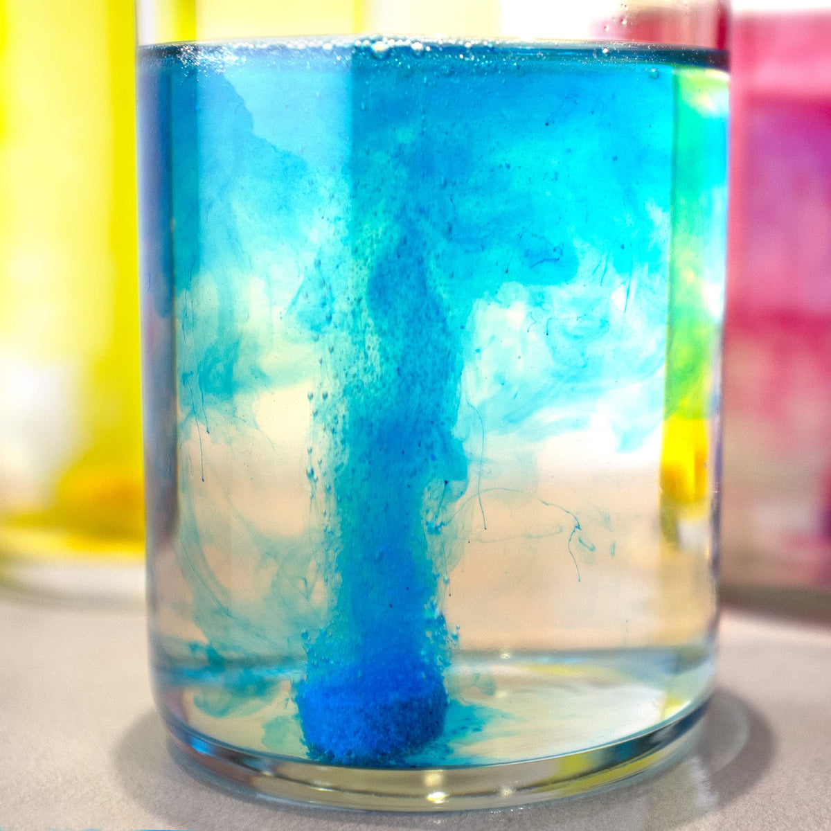 Mr. Bubble mixed red and blue water demonstrating color-mixing fun