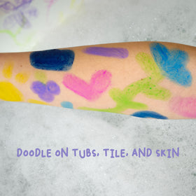 Mr. Bubble paint stick next to child's hand to show size and easy grip