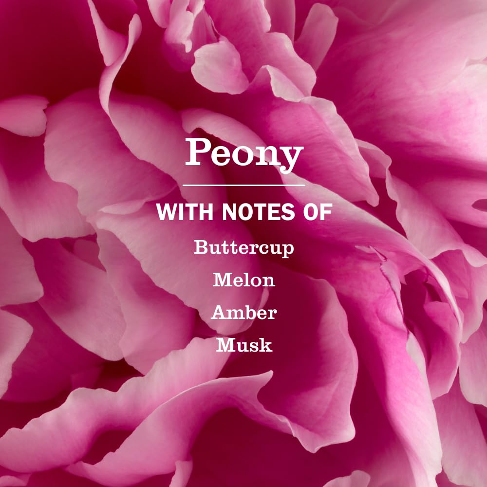Mrs. Meyer's peony refill being poured into a pump bottle for easy refill