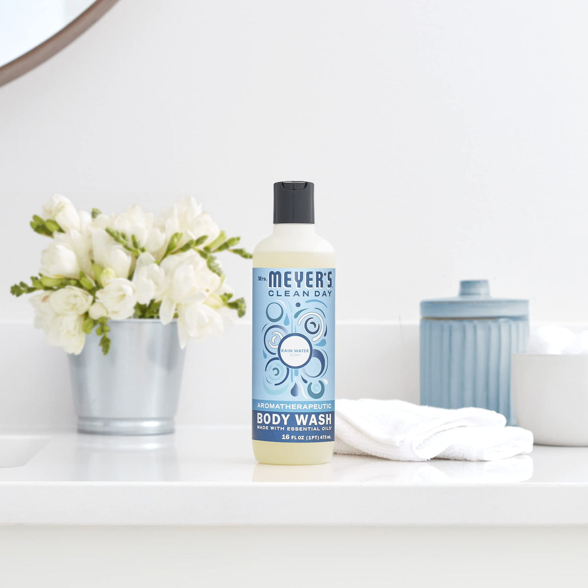Mrs. MEYER'S displayed on bathroom shelf with accessories, creating cohesive home fragrance
