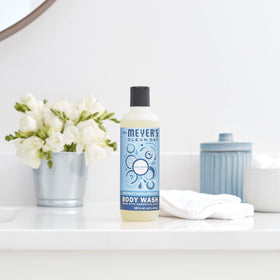 Mrs. MEYER'S displayed on bathroom shelf with accessories, creating cohesive home fragrance