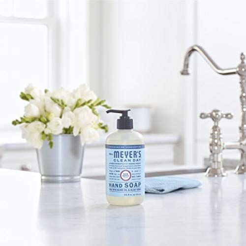 Mrs. MEYER'S bottle beside a hand showing 12.5 fl oz scale for accurate sizing