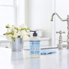 Mrs. MEYER'S bottle beside a hand showing 12.5 fl oz scale for accurate sizing