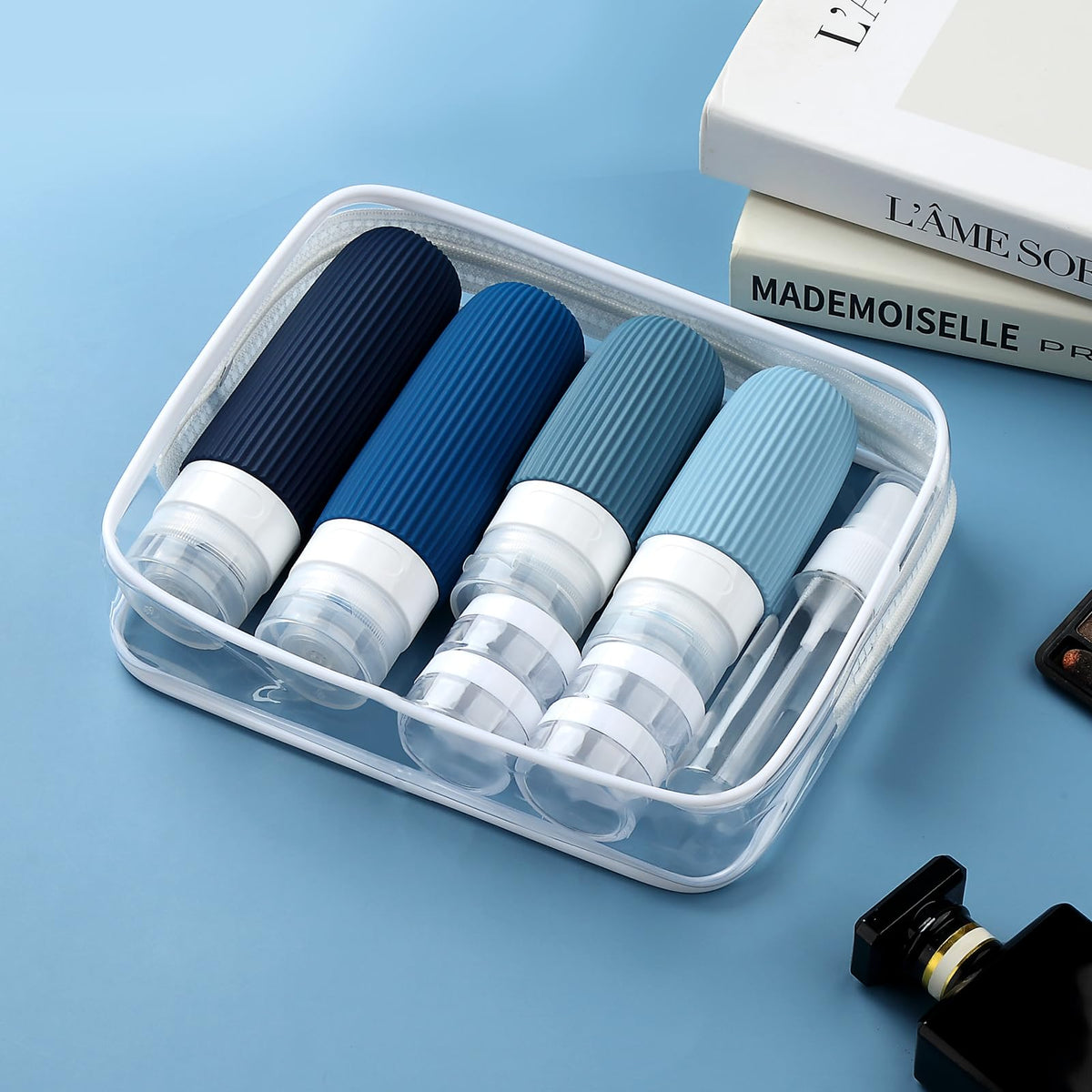 Mrsdry clear toiletry bag open displaying all 16 pieces for airport compliance