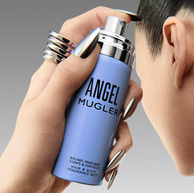 Mugler Angel bottle next to hand for size comparison and travel-friendly benefit