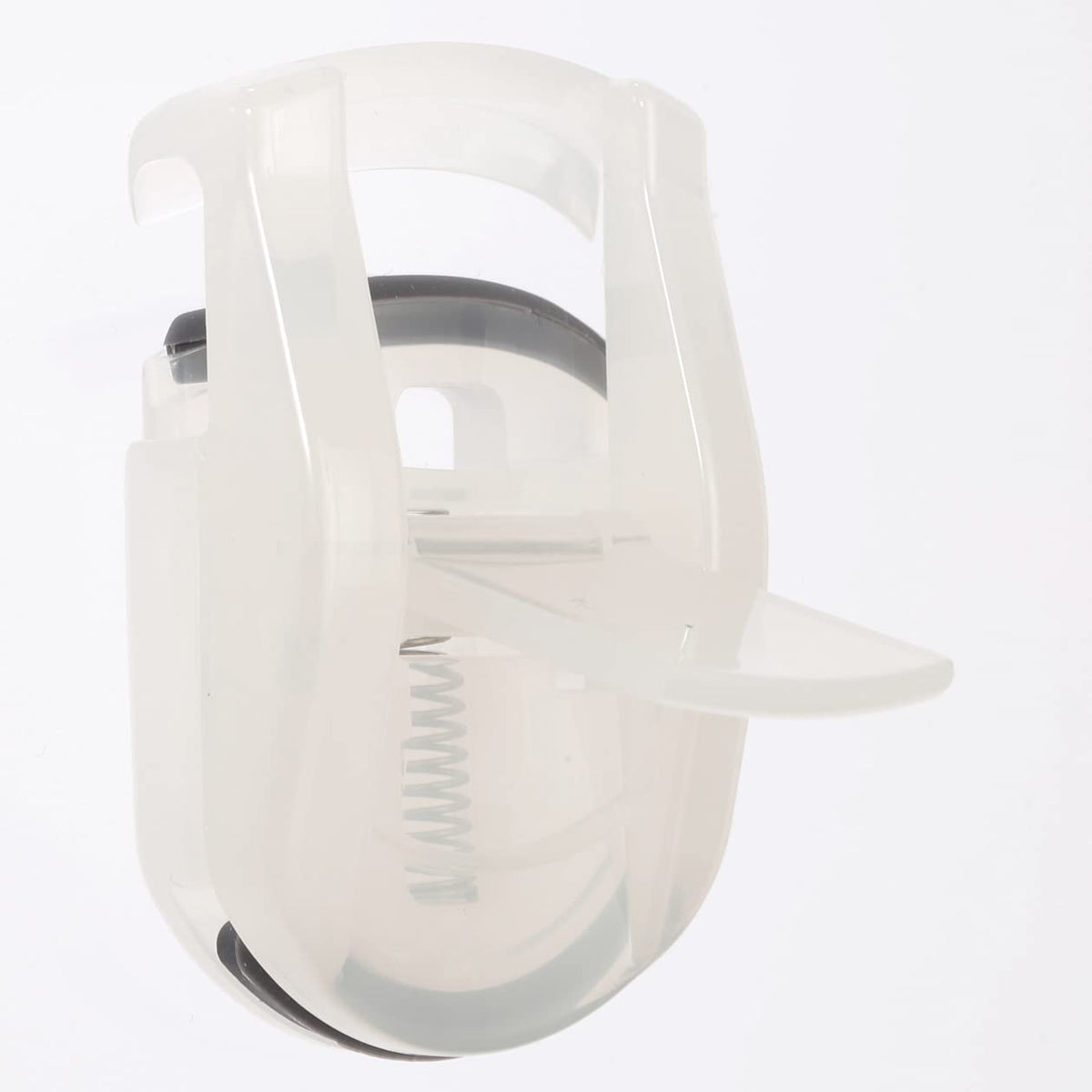 MUJI portable eyelash curler rubber pad closeup showing replacement pad for consistent curl