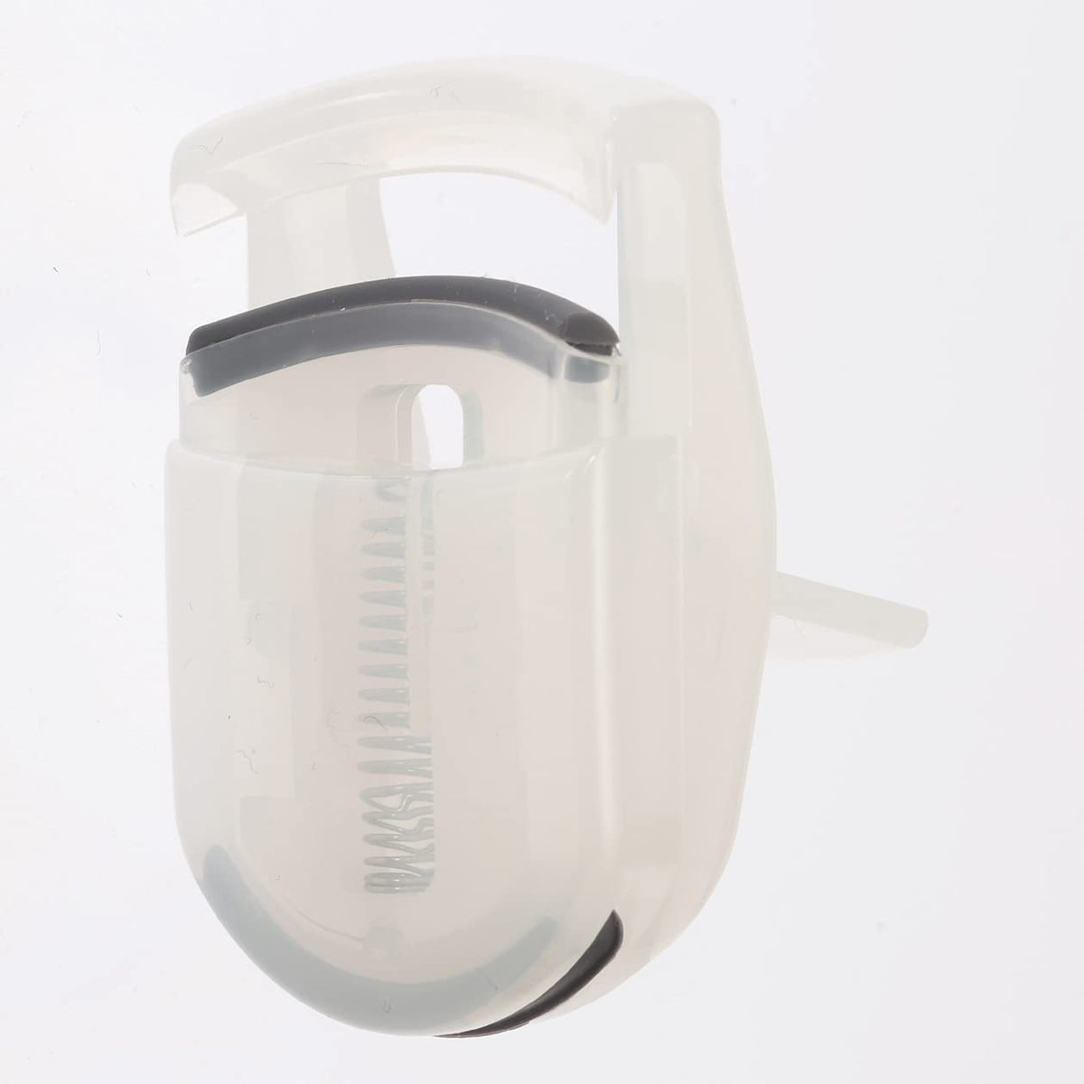 MUJI portable eyelash curler slide-closed detail protecting the curling head for travel