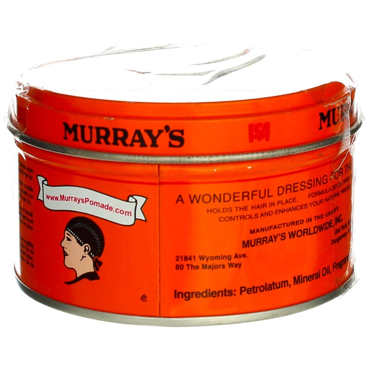 Hand holding Murray's tin for scale showing compact travel-friendly benefit