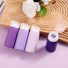 Muslish spray bottle in hand demonstrating travel-friendly 1oz size and convenient misting