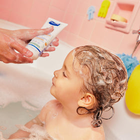 Mustela creamy shampoo texture close-up illustrating slip for easy detangling