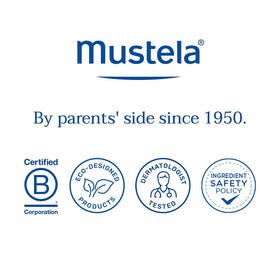 Mustela family at the beach using spray for water-resistant protection