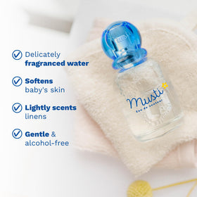 Mustela mist spraying to show fine texture and gentle scent distribution