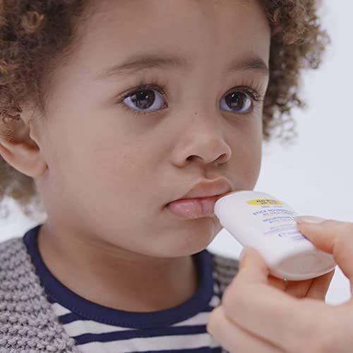 Mustela nourishing stick being applied to baby cheek to soothe and protect skin