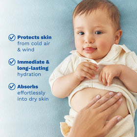 Mustela travel-size bottle beside hand for scale and convenience