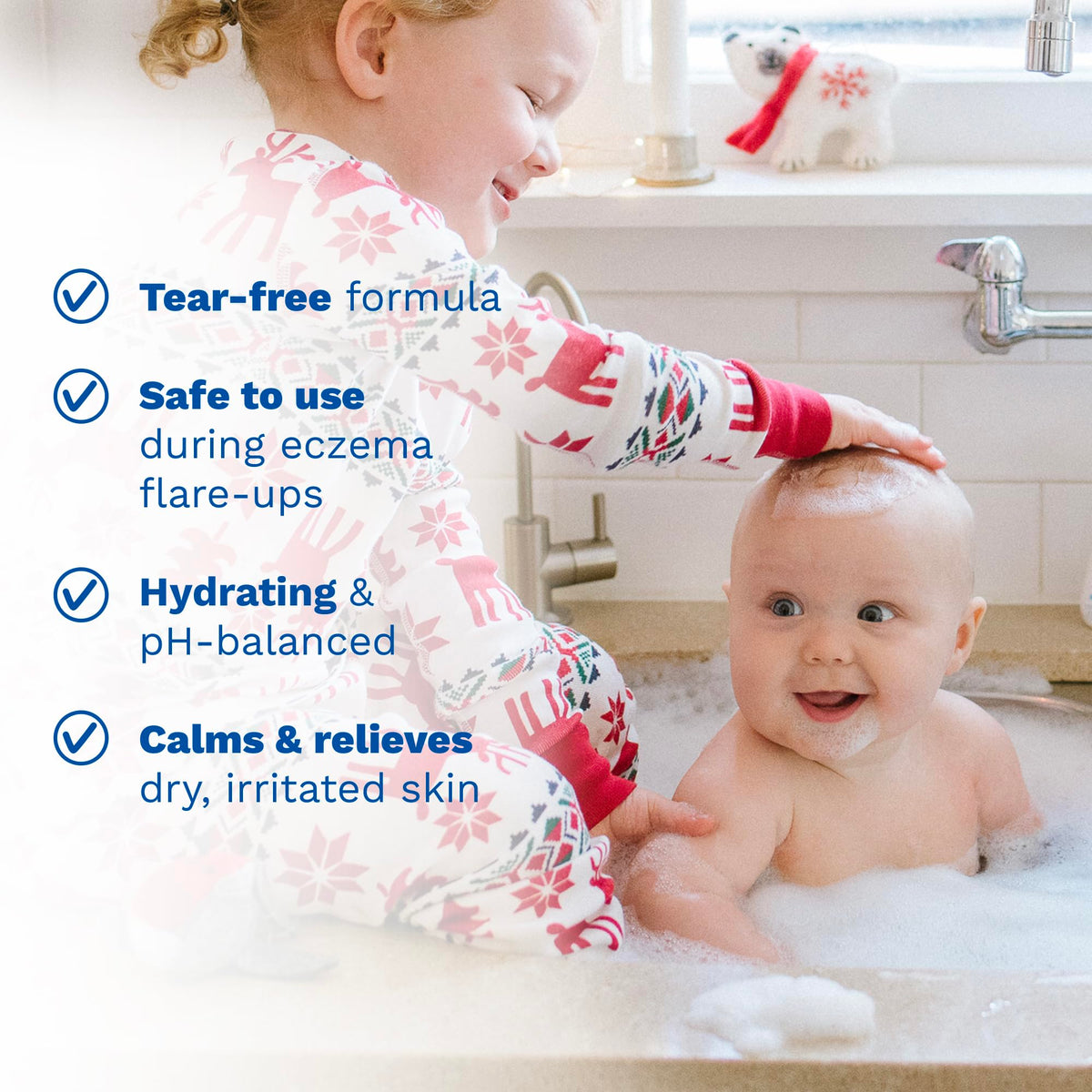 Parent bathing infant with Mustela Stelatopia, demonstrates tear-free gentle wash