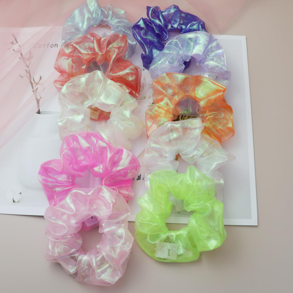 MUYANN scrunchie next to ruler showing compact size and fit