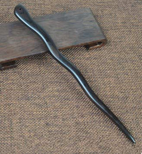 Myhsmooth two sticks crossed in hair demonstrating stronger hold and decorative finish