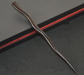 Myhsmooth hair sticks securing a bun showing reliable hold and elegant look