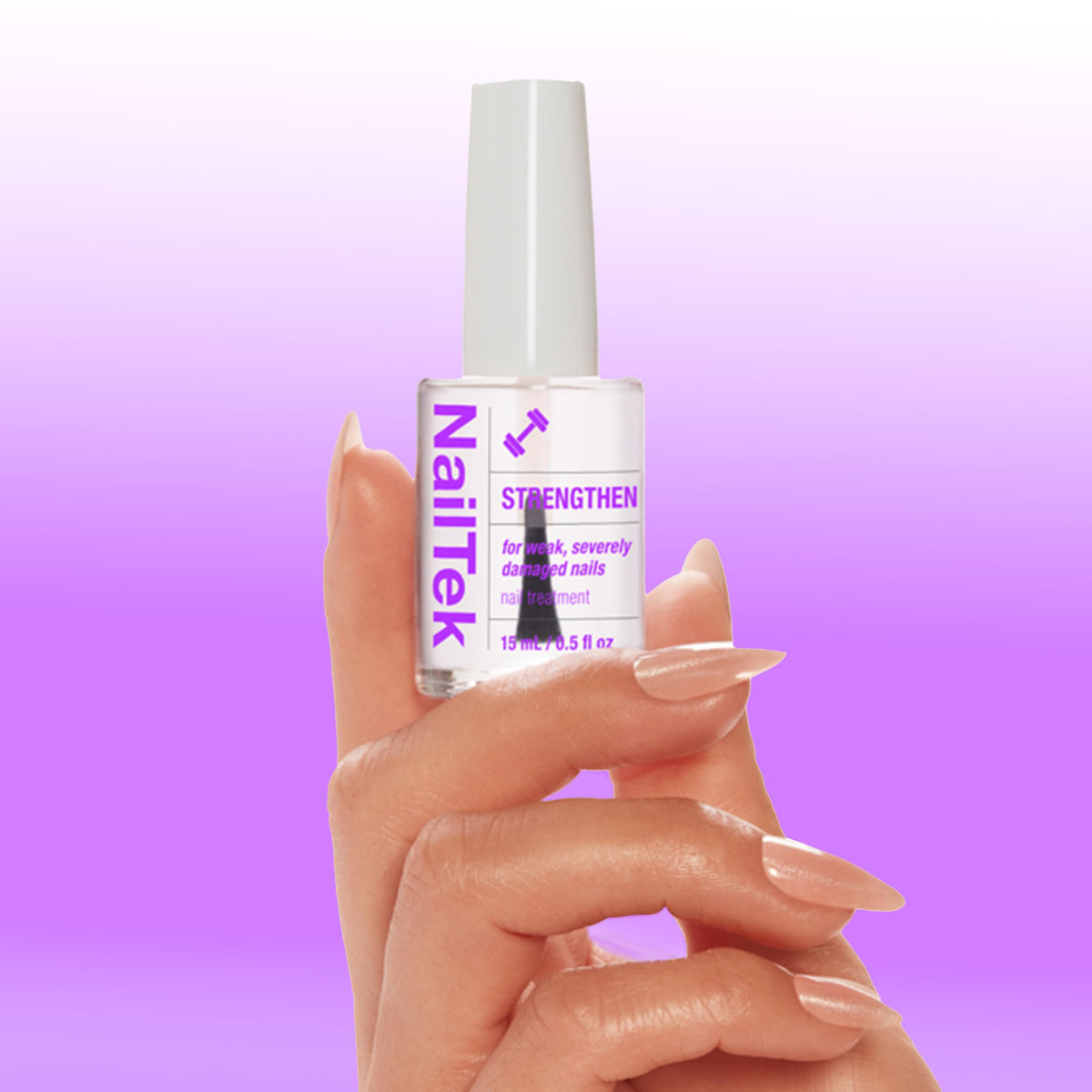 Nail Tek 0.5 fl oz bottle beside a coin illustrating compact travel-friendly size