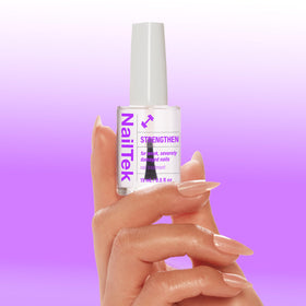 Nail Tek 0.5 fl oz bottle beside a coin illustrating compact travel-friendly size