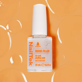Nail Tek applied under color showing improved polish adhesion and even finish