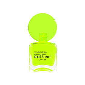 Nails Inc bottle in hand to show size and travel-friendly scale