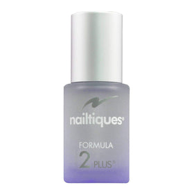 Nailtiques brush applying formula to nail edge to build strength and reduce peeling
