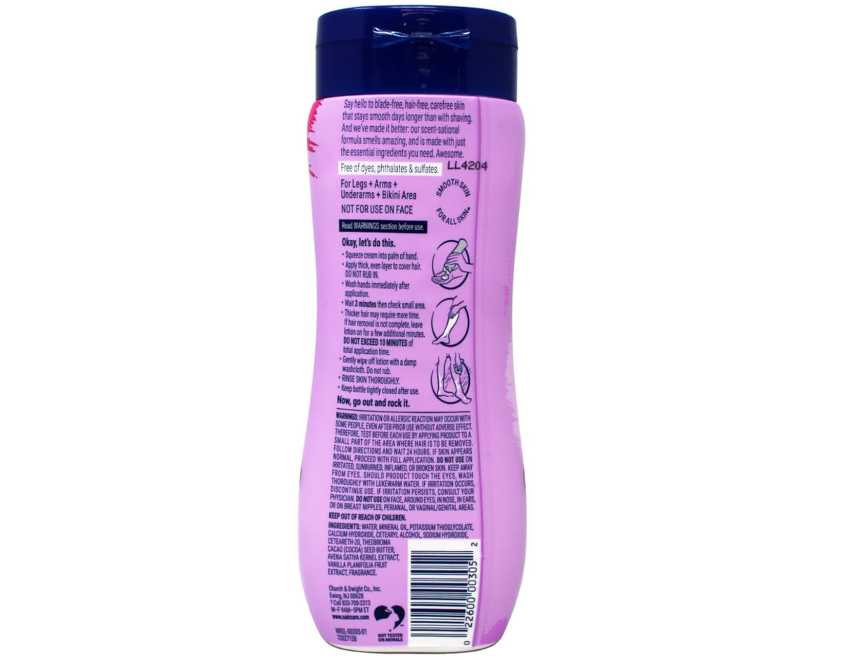Nair cream applied to leg with spatula demonstrating quick, smooth removal
