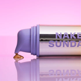 Naked Sundays bottle tucked inside a beach bag for daily sun protection