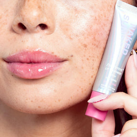 Naked Sundays tube beside keys showing compact 15ml pocket-friendly benefit