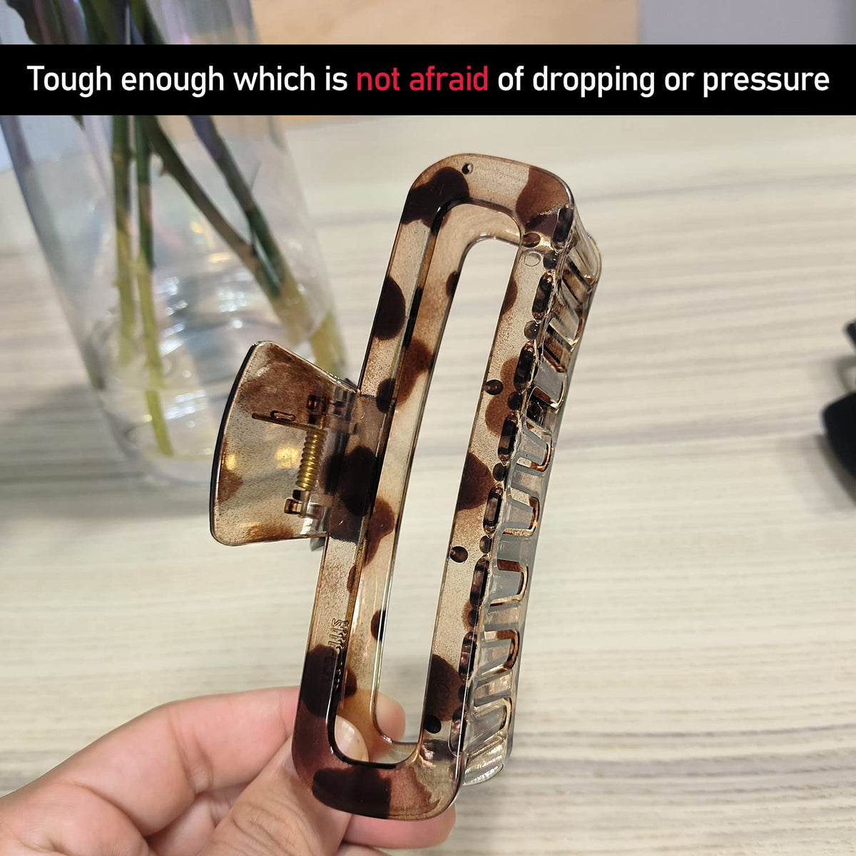 Nalodu close-up of glossy leopard clip pattern adding fashionable contrast