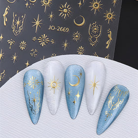 Namrec finished mixed manicure lifestyle shot, shows stylish celestial accents for events