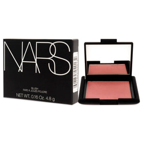 NARS Orgasm blush next to everyday items for scale, travel-friendly benefit