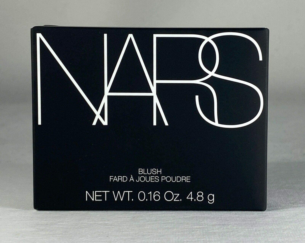 NARS compact in hand for scale and accurate size reference