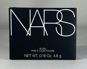 NARS compact in hand for scale and accurate size reference