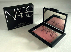 NARS pan close-up revealing peachy-pink color and soft golden shimmer