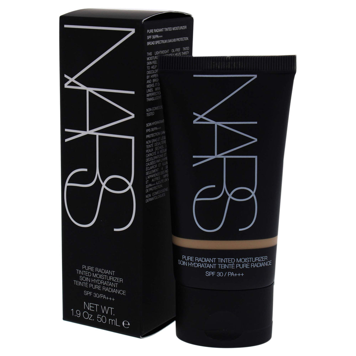 NARS 1.9 ounce bottle next to coin for scale showing travel-friendly size