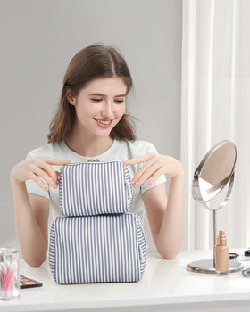 Narwey size comparison with passport and phone illustrating the bag's travel-friendly dimensions