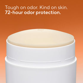 Native applying stick in hand, demonstrates easy application and non-greasy finish