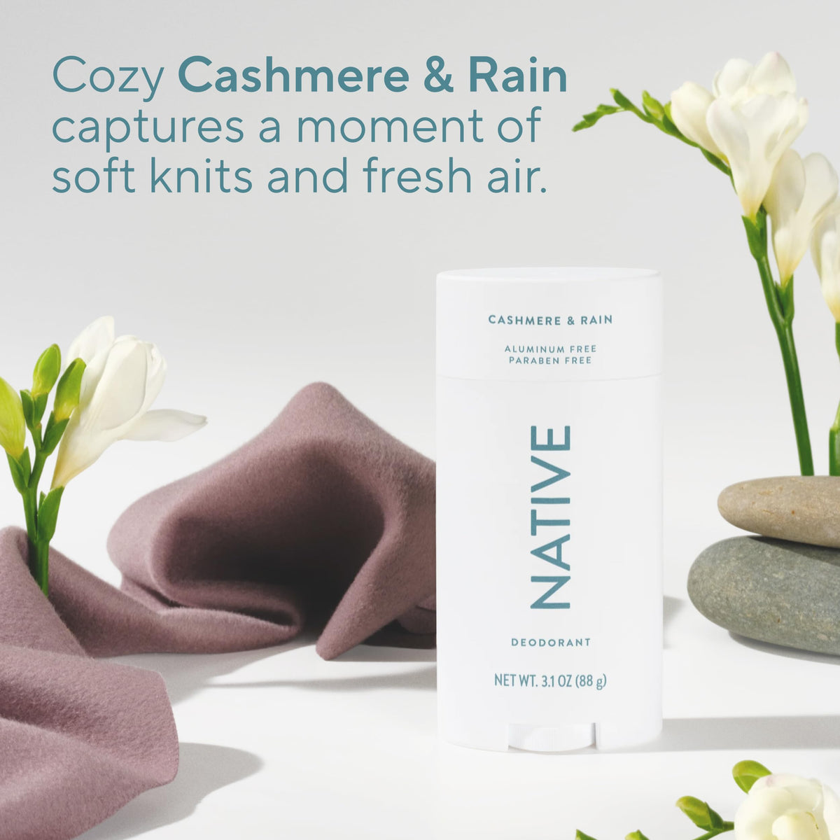 Applying Native Cashmere & Rain on forearm demonstrating clear, non-staining finish and confidence benefit