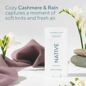 Applying Native Cashmere & Rain on forearm demonstrating clear, non-staining finish and confidence benefit