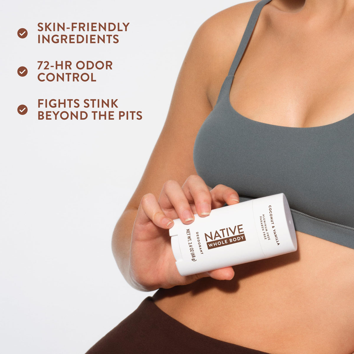 Native stick held in hand to show 2.3oz scale, brand offering travel-friendly size